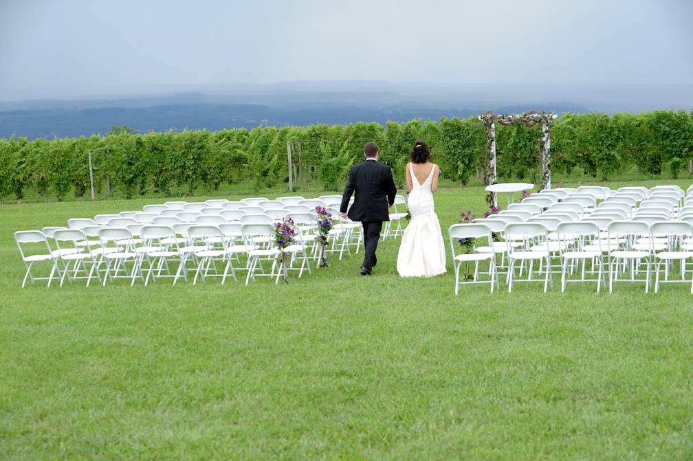 Couple in wedding aisle – Photo credit Rick Bacmanski Photo Artistry