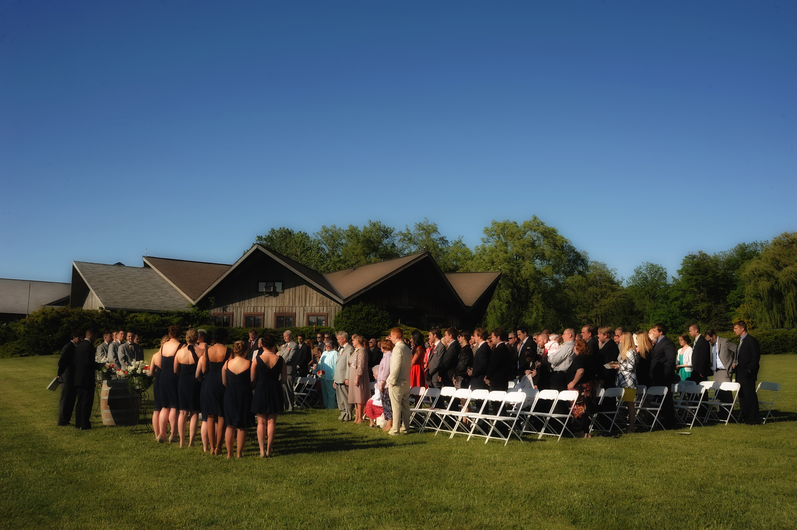 Outdoor wedding ceremony – Photo credit Baker Photography